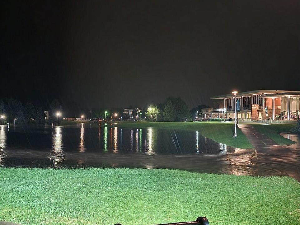 Water from heavy rainfall fills the lagoon and surrounding retaining walls near the Lory Student Center on Colorado State University's main campus in Fort Collins, Colo., on Friday, July 31, 2023. At least four buildings on campus were damaged by floodwater, university officials said.