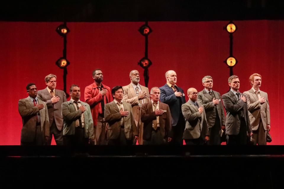 The jurors sing a pledge in “Twelve Angry Men: A New Musical” at Asolo Repertory Theatre.