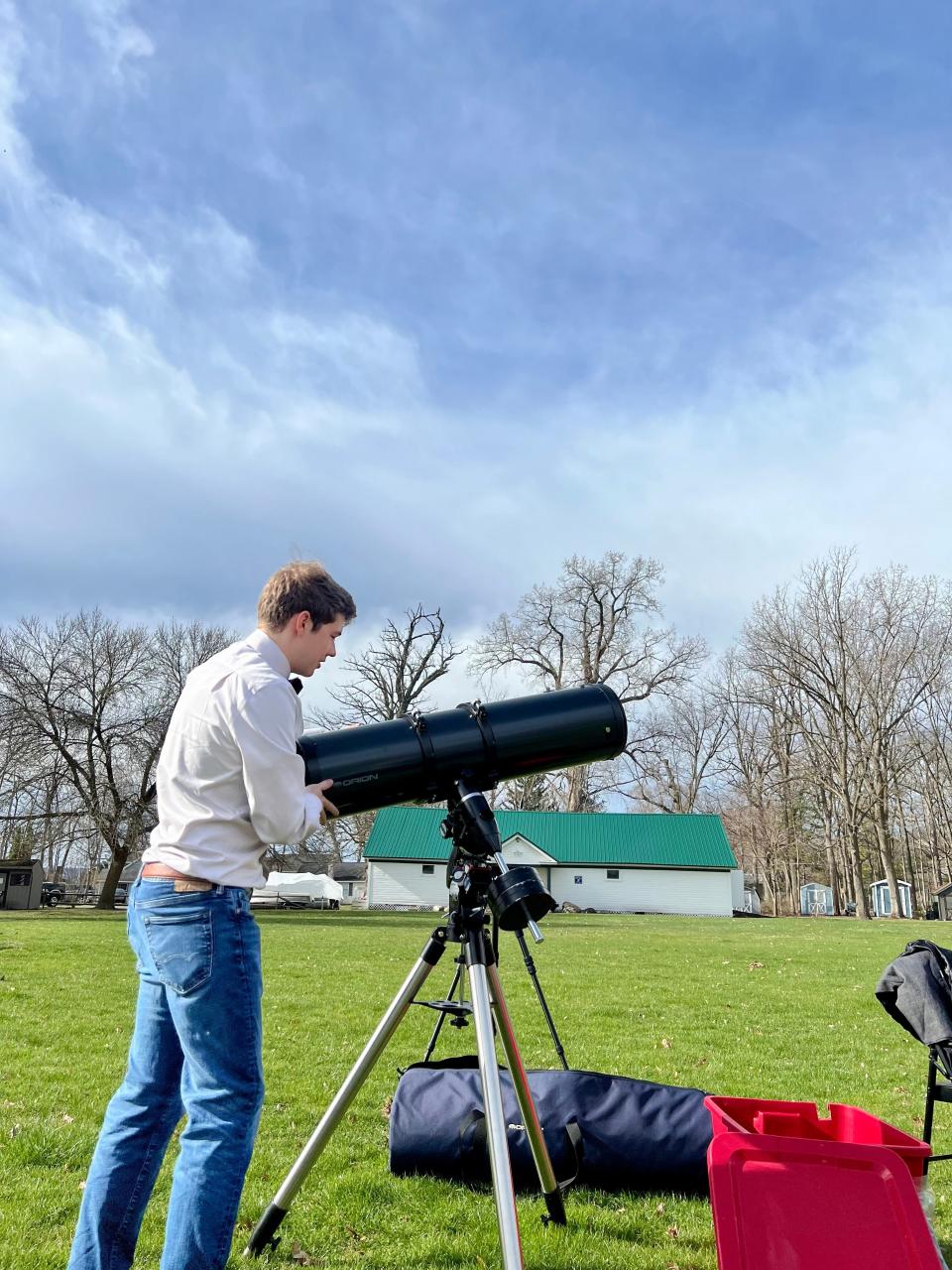 Josef Zimmerman sets up his telescope last month at Geneseo's Long Point Park to prepare for the solar eclipse.