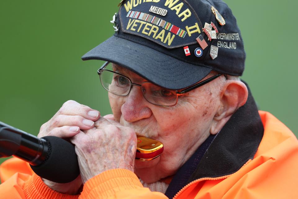 Pete DuPre', a 95-year-old WWll veteran plays the National Anthem on his harmonica before the Rochester Red Wings home opener. 