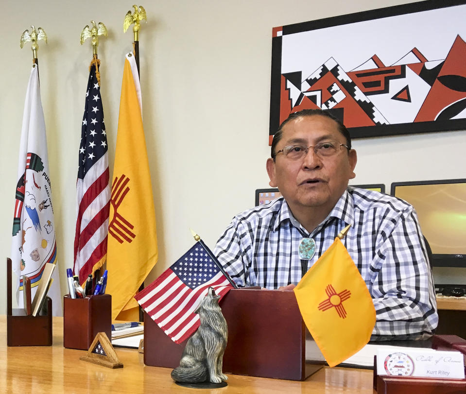FILE - In this June 8, 2016, photo, Gov. Kurt Riley, of Acoma Pueblo, discusses his tribe's move to repatriate a ceremonial shield from Paris, France, during an interview in Acoma Pueblo, N.M. A ceremonial shield has been returned to New Mexico more than three years after it became central to an international debate over the export of Native American items. U.S. and Acoma Pueblo officials planned Monday, Nov. 18, 2019, to announce the shield’s return from Paris, where it had been listed for bidding in 2016 before the EVE auction house took the rare step of halting its sale. (AP Photo/Mary Hudetz, File)