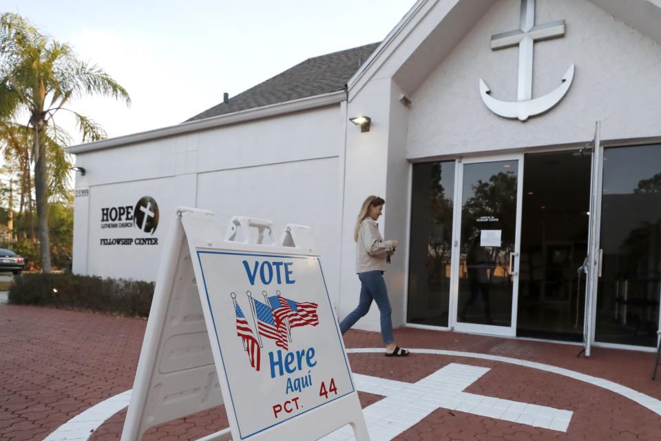 A voter walks into a polling station for the Florida presidential primary, Tuesday, March 17, 2020, in Bonita Springs, Fla. Floridians are voting across the state as election officials manage losses of poll workers and changes to polling places because of the coronavirus. There had been concern some polling places might not open on time Tuesday because of worker absences, but no problems have been reported. (AP Photo/Elise Amendola)