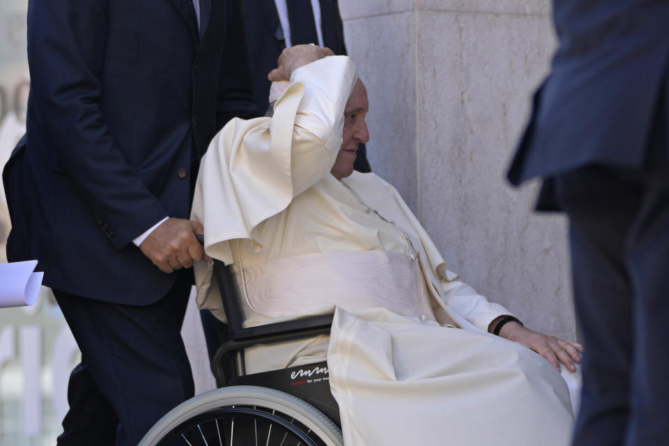 Pope Francis holds his skull cap in place on arrival to meet with representatives of charity centers in the parish of Serafina in Lisbon, Friday, Aug. 4, 2023. Pope Francis is on the third day of a five-day pastoral visit to Portugal that includes the participation at the 37th World Youth Day, and a pilgrimage to the holy shrine of Fatima. (AP Photo/Armando Franca)