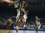 Stanford forward Jaiden Delaire, center, attempts a shot between Baylor forward Jeremy Sochan, left, and guard Dale Bonner, right, in the first half of an NCAA college basketball game, Saturday, Nov. 20, 2021, in Waco, Texas. (AP Photo/Jerry Larson)