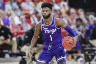 TCU's Mike Miles (1) controls the ball during the first half of an NCAA college basketball game against Texas Tech in Lubbock, Texas, Tuesday, March 2, 2021. (AP Photo/Justin Rex)