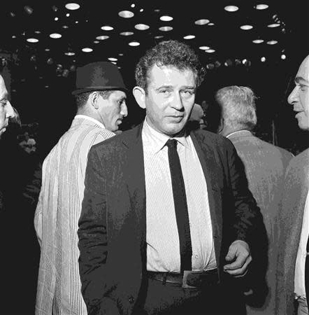 Writer Norman Mailer is seen attending the WBA/WBC World Heavyweight fight between Cassius Clay and Sonny Liston in this Miami Herald photo from HistoryMiami taken in Miami Beach, Florida February 25, 1964. REUTERS/Miami Herald/HistoryMiami/Handout