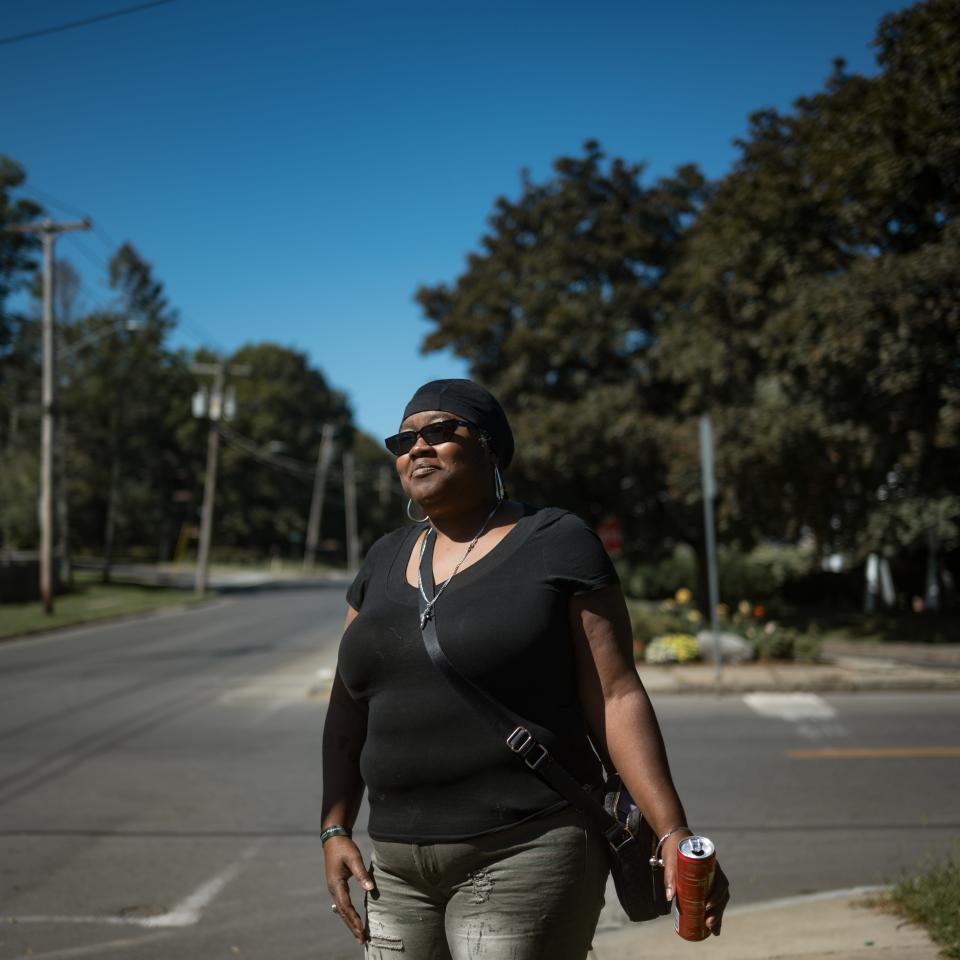 Deshane Levere stands at the intersection of Onondaga Avenue and Bellevue Avenue in Syracuse, NY on Friday, September 15, 2023. A decade prior, a Syracuse police cruiser ran a redlight and crashed into Levere's four-door sedan, injuring her back.