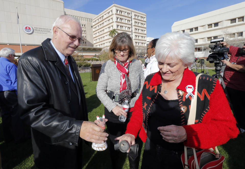 Tucson shooting survivors Bill Posey and Nancy Bowman, center, and Patricia Maisch, who helped stop the shooter, ring bells during a remembrance ceremony on the third anniversary of the Tucson shootings, Wednesday, Jan. 8, 2014, in Tucson, Ariz. Six people were killed and 13 wounded, including U.S. Rep. Gabrielle Giffords, D-Ariz., in the shooting rampage at a community event hosted by Giffords in 2011. Jared Lee Loughner was sentenced in November 2012 to seven consecutive life sentences, plus 140 years, after he pleaded guilty to 19 federal charges in the shooting. (AP Photo/Matt York)