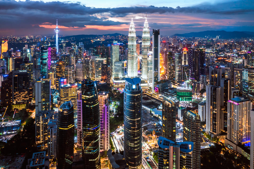 Aerial view of KLCC skyline with Petronas Twin Towers at twilight, Kuala Lumpur, Malaysia. (Photo: Gettyimages)