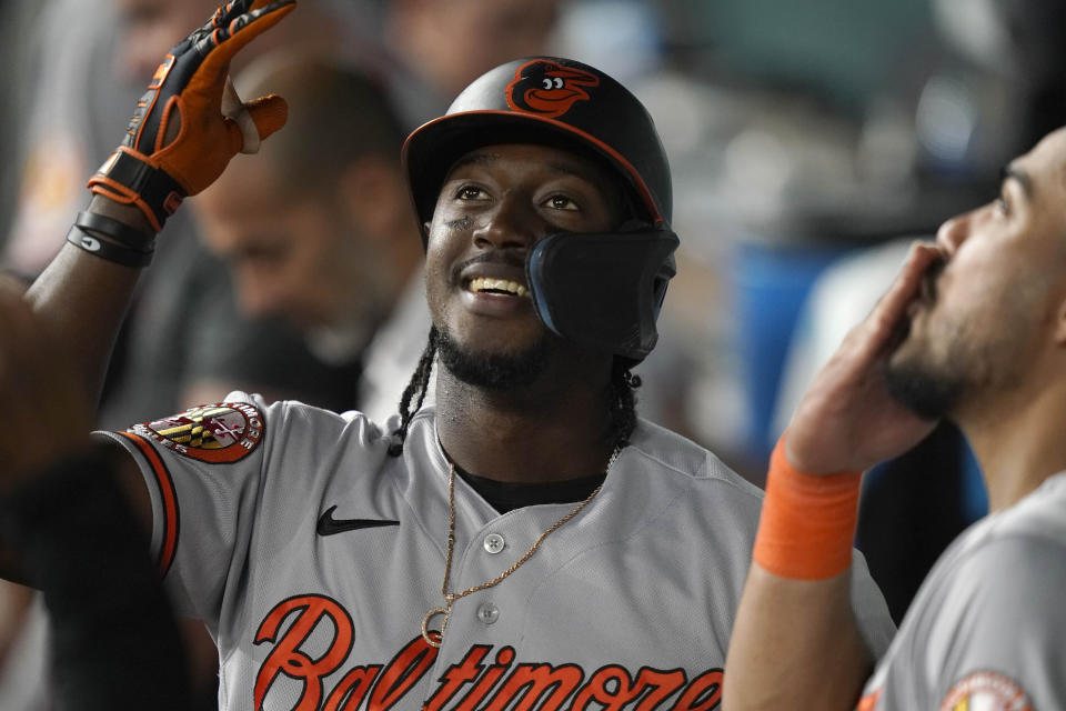 Baltimore Orioles' Jorge Mateo celebrates with teammates in the dugout after his solo home run during the fifth inning of a baseball game against the Texas Rangers in Arlington, Texas, Monday, April 3, 2023. (AP Photo/LM Otero)