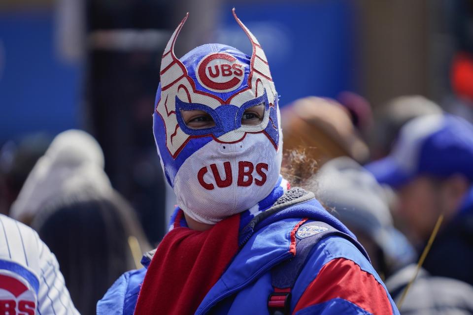 A fans wears a Cubs-themed lucha libre mask outside Wrigley Field before the opening day baseball game between the Chicago Cubs and Milwaukee Brewers, Thursday, March 30, 2023, in Chicago. (AP Photo/Erin Hooley)