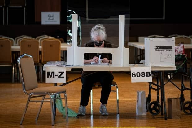 Voters cast ballots at an advance polling station, at the Noor Cultural Centre, in Toronto, on Sept. 10. (Evan Mitsui/CBC - image credit)