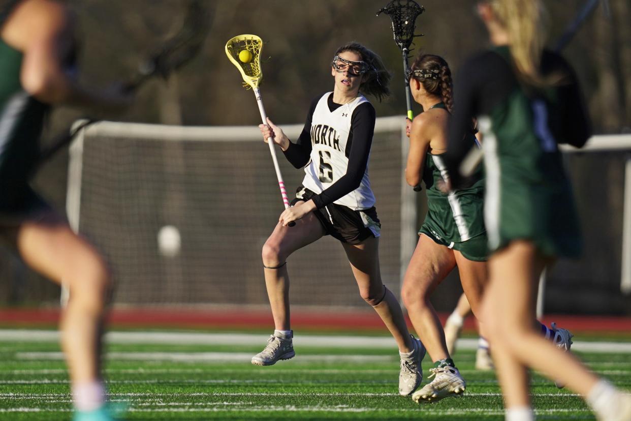 Phoebe Pullyblank, left, of North Kingstown, looks to make a play during Friday's game against Chariho.