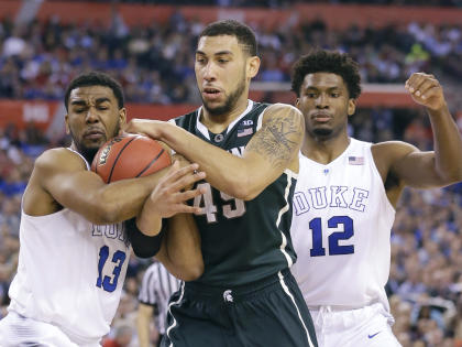 Michigan State's Denzel Valentine (C) fights for a loose ball with Duke's Matt Jones (L) and Justise Winslow during the second half. (AP)