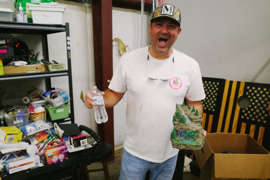 Evening Anchor Ben Hoover spent some time sorting through donated goods at the Three Tails ReSale thrift store (photo: Cristina Byrne, WHNT)