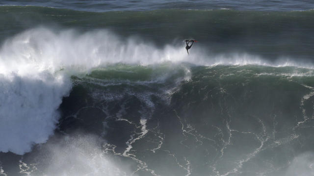 Hurricane-generated swell draws big wave surfers to Portugal's Nazare