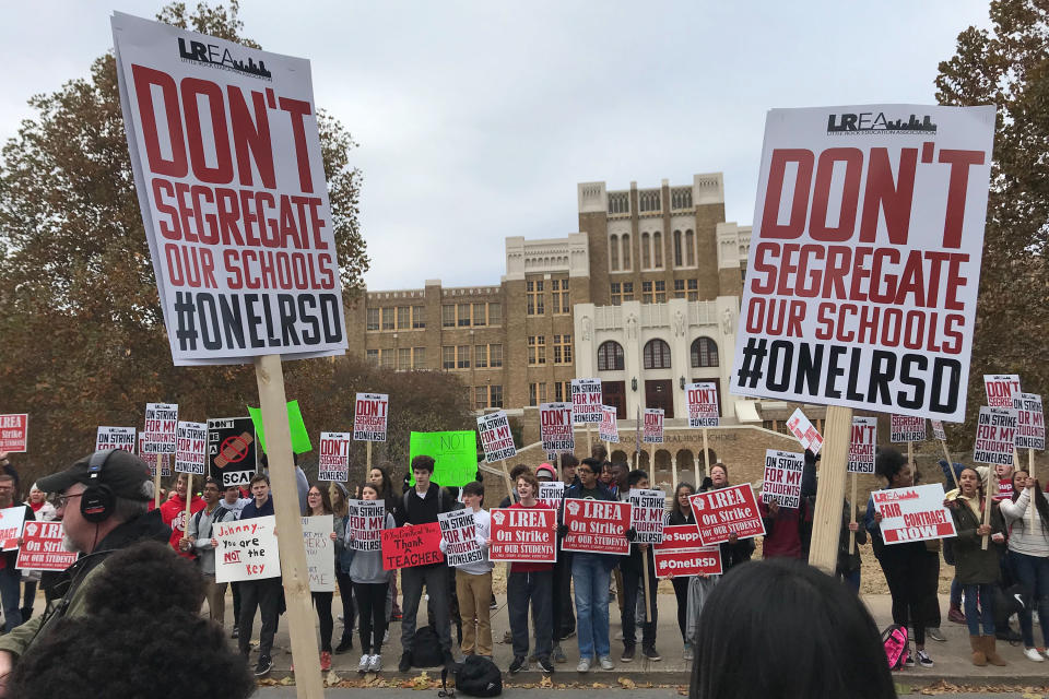 Teachers, parents and students picket outside Central High School in Little Rock, Arkansas on Thursday, Nov. 14, 2019. Teachers are staging what's being billed as a one-day strike to protest the state's control of the local school district and their loss of collective bargaining rights. (AP Photo/Andrew Demillo)