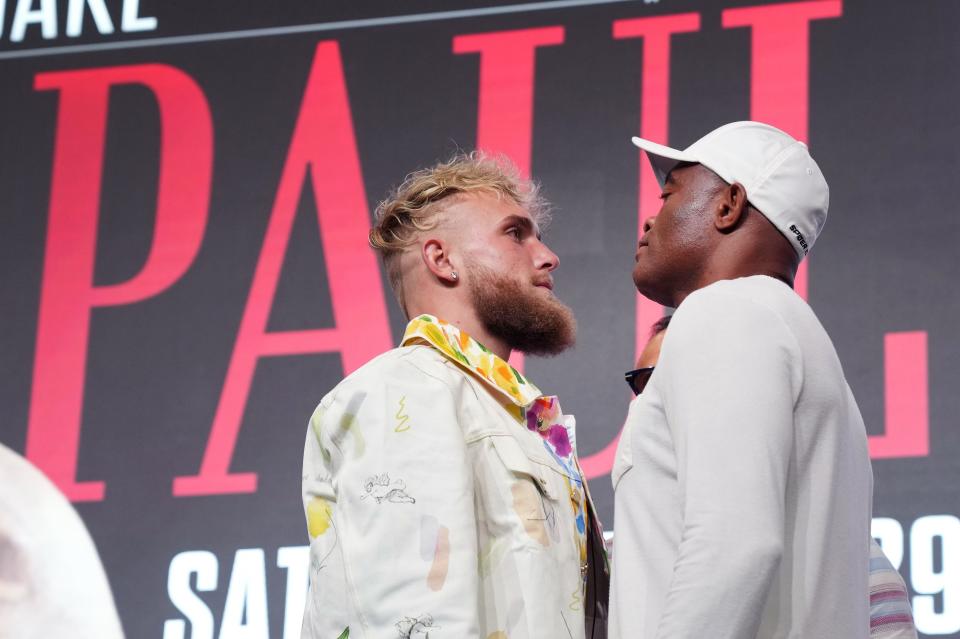 Jake Paul and Anderson Silva pose for photos during a news conference at Desert Diamond Arena on Thursday, Oct. 27, 2022 to preview their Saturday night fight.