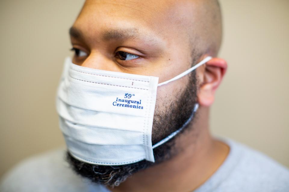 Phillip King, a UAW member who works for Ford Motor Co., making face masks, wears a sample mask like the 30,000 Ford donated for use at the presidential inauguration of Joe Biden on Jan. 20, 2021.