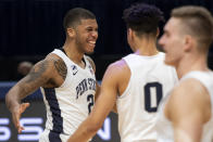 CORRECTS TO MYLES DREAD, INSTEAD OF JAMARI WHEELER - Penn State guard Myles Dread (2) celebrates with guard Myreon Jones (0) after scoring a buzzer-beater 3-point shot against Minnesota during an NCAA college basketball game Wednesday, March 3, 2021, in State College, Pa. (Noah Riffe/Centre Daily Times via AP)