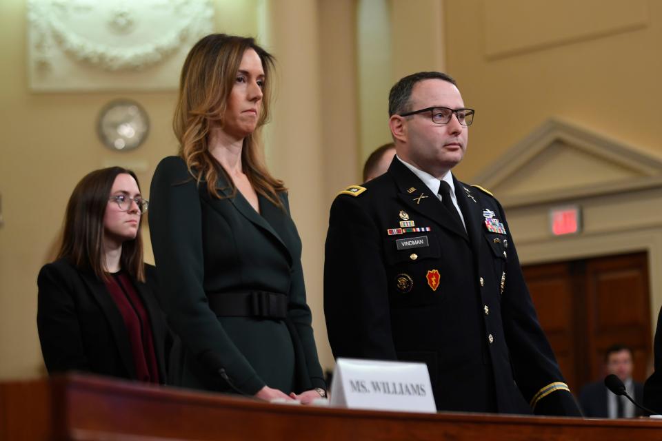 Jennifer Williams, a foreign policy aide to Vice President Mike Pence, 2nd from left, and Lieutenant Colonel Alexander Vindman, a Ukraine expert for the National Security Council, arrive at Tuesday's Intelligence Committee hearing.