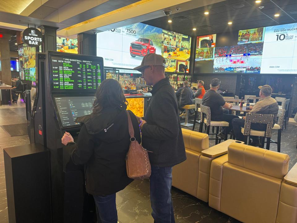 The sports book at Cadillac Jack's Gaming Resort in Deadwood, S.D., fits seamlessly into the rest of the casino, offering patrons the ability to gamble on games and slots at the same time.