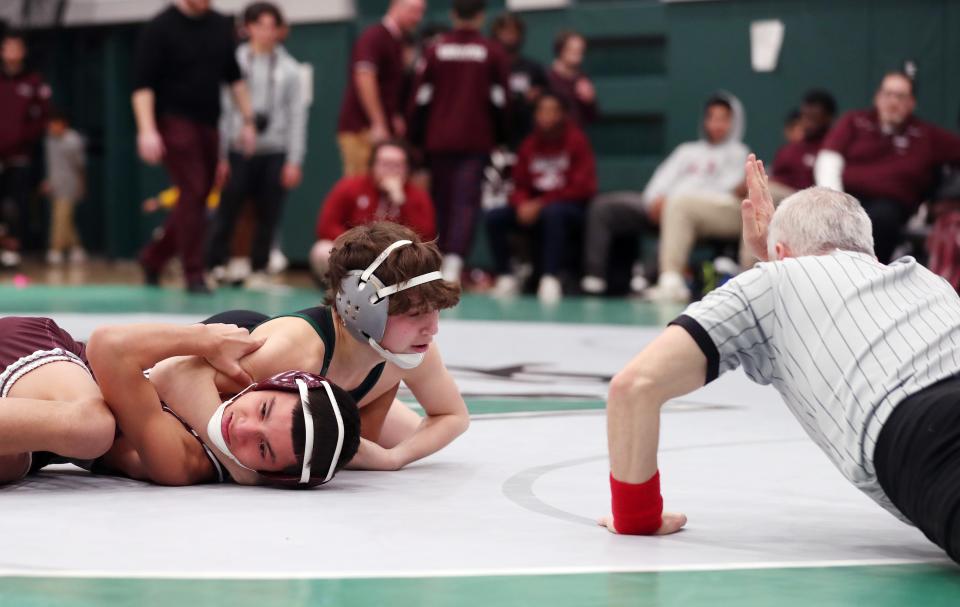 Gio Tornambe from Yorktown and Angel Ibarra from Ossining wrestle in the 108-pound weight class during the Section 1 Division I Dual Meet Tournament at Yorktown High School Dec. 21, 2023. Tornambe won the match.