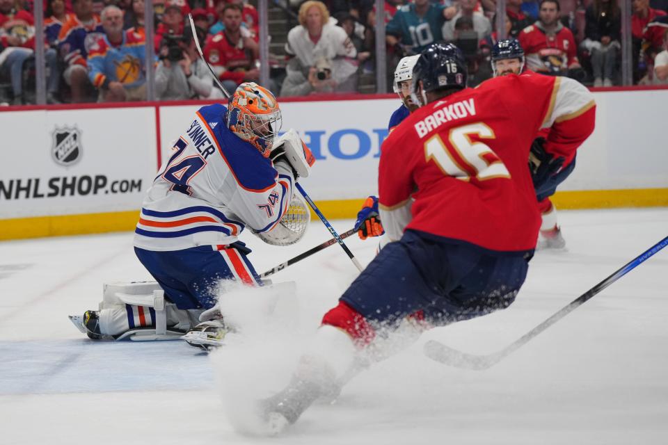 Jun 8, 2024; Sunrise, Florida, USA; Edmonton Oilers goaltender Skinner Stuart (74) defends against Florida Panthers forward Aleksander Barkov (16) during the second period in game one of the 2024 Stanley Cup Final at Amerant Bank Arena. Mandatory Credit: Jim Rassol-USA TODAY Sports