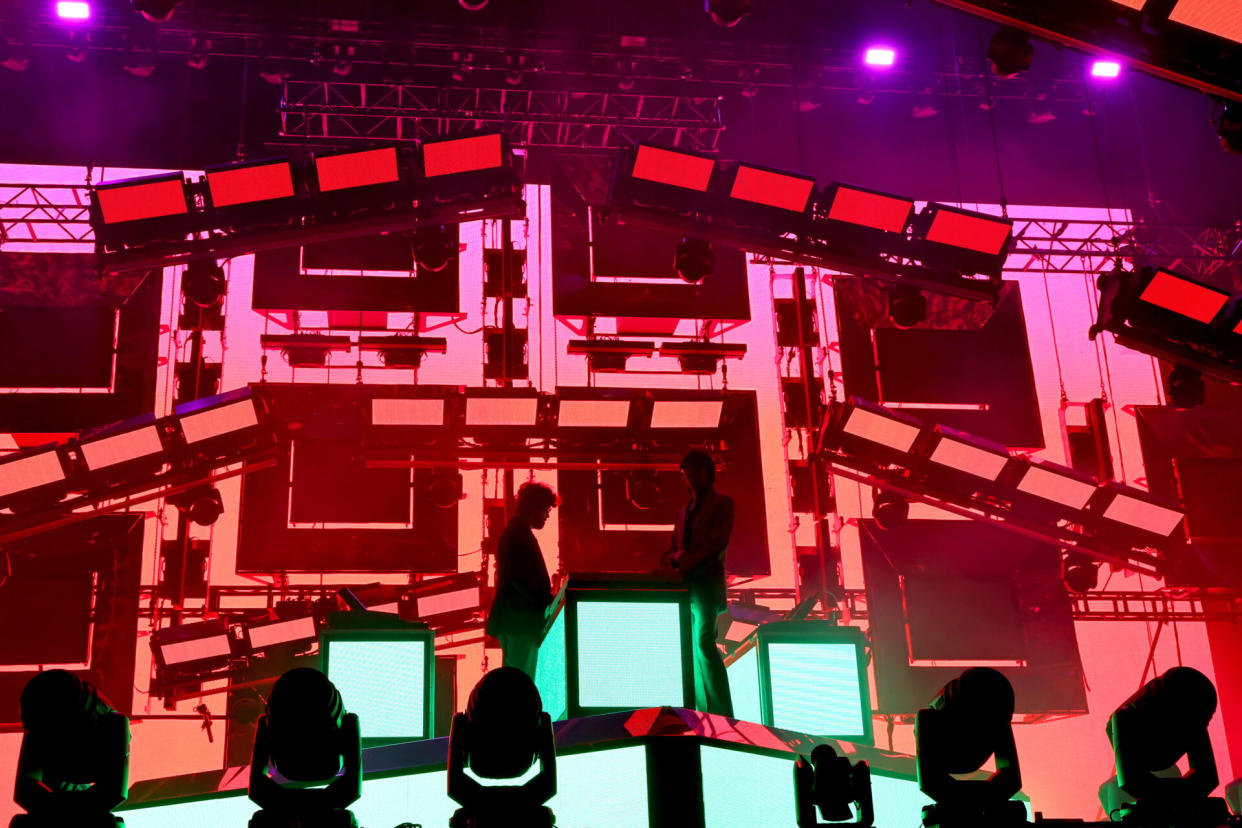 Gaspard Augé and Xavier de Rosnay of Justice perform at an earlier show (Photo by Amy Sussman/Getty Images for Coachella)