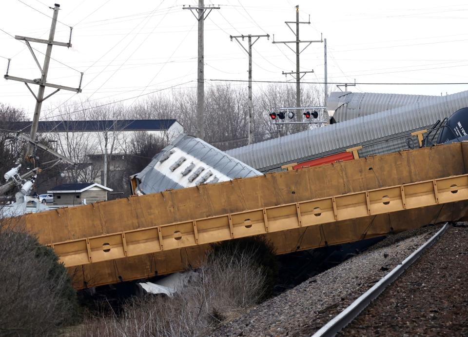 Multiple cars of a Norfolk Southern train lie toppled on one another after derailing at a train crossing with Ohio 41 in Clark County, Ohio, Saturday, March 4, 2023. (Bill Lackey/Springfield-News Sun via AP)