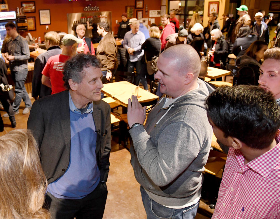 Sen. Sherrod Brown (D-OH) (L) speaks to voters including Scott Adams of Nevada at the Lovelady Brewing Company as part of the Nevada Democratic Party's lecture series, "Local Brews + National Views" on February 23, 2019 in Henderson, Nevada.  (Photo: Ethan Miller/Getty Images)