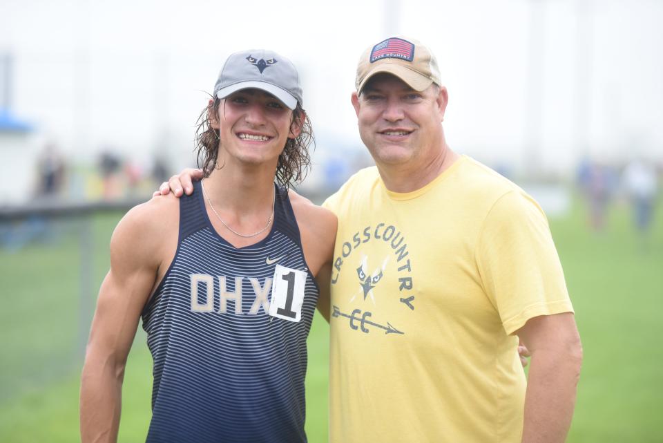 Croswell native Eric Jackson (right) is seen with his son, Owen, after the 27th Mike Jackson Memorial Invitational at Croswell-Lexington High School in Croswell on Thursday, Aug. 24.
