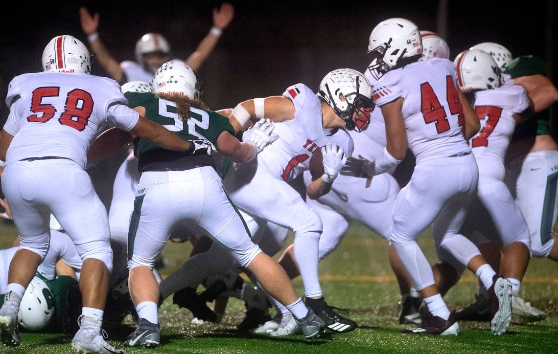 Yelm running back Ray Wright powers into the end zone for a two-point conversion during Friday night’s football game against the Peninsula Seahawks at Roy Anderson Field in Purdy, Washington, on Oct. 21, 2022.