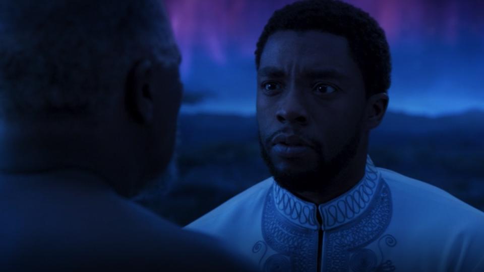 T'Challa meets with his father in the purple and blue sky realm of the Ancestral Plane