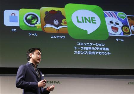 Takeshi Idezawa, chief operating officer of Line Corp, speaks during an announcement of its new service in Tokyo February 26, 2014. REUTERS/Yuya Shino