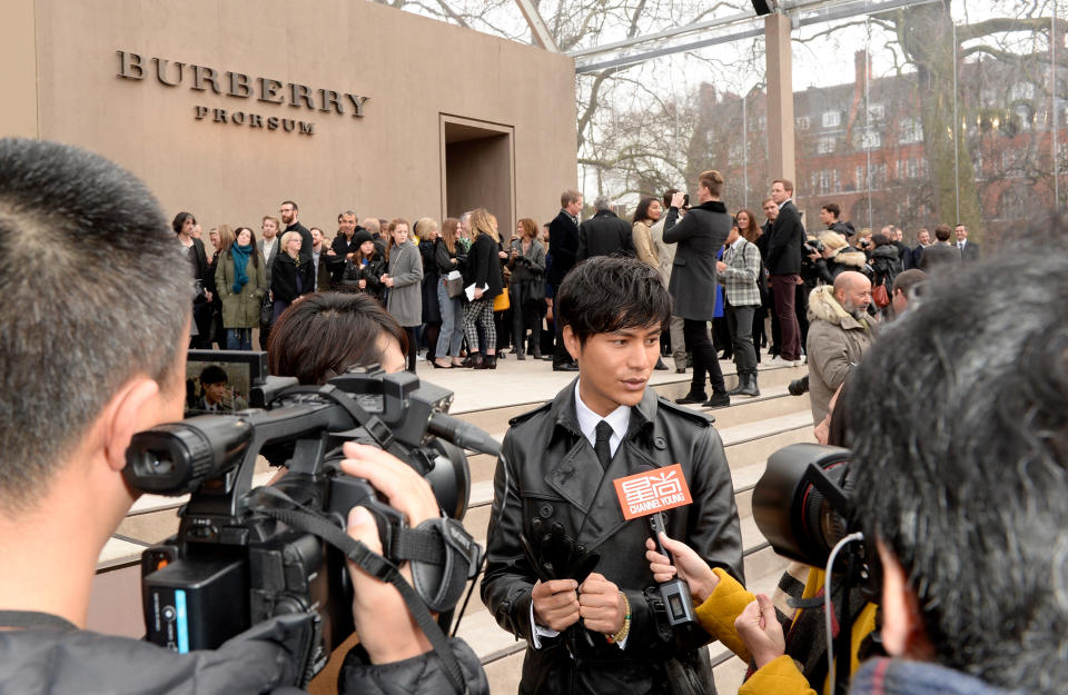 Chen Kun was interviewed after the Burberry fall 2014 menswear show at Kensington Gardens on January 8, 2014, in London, England.