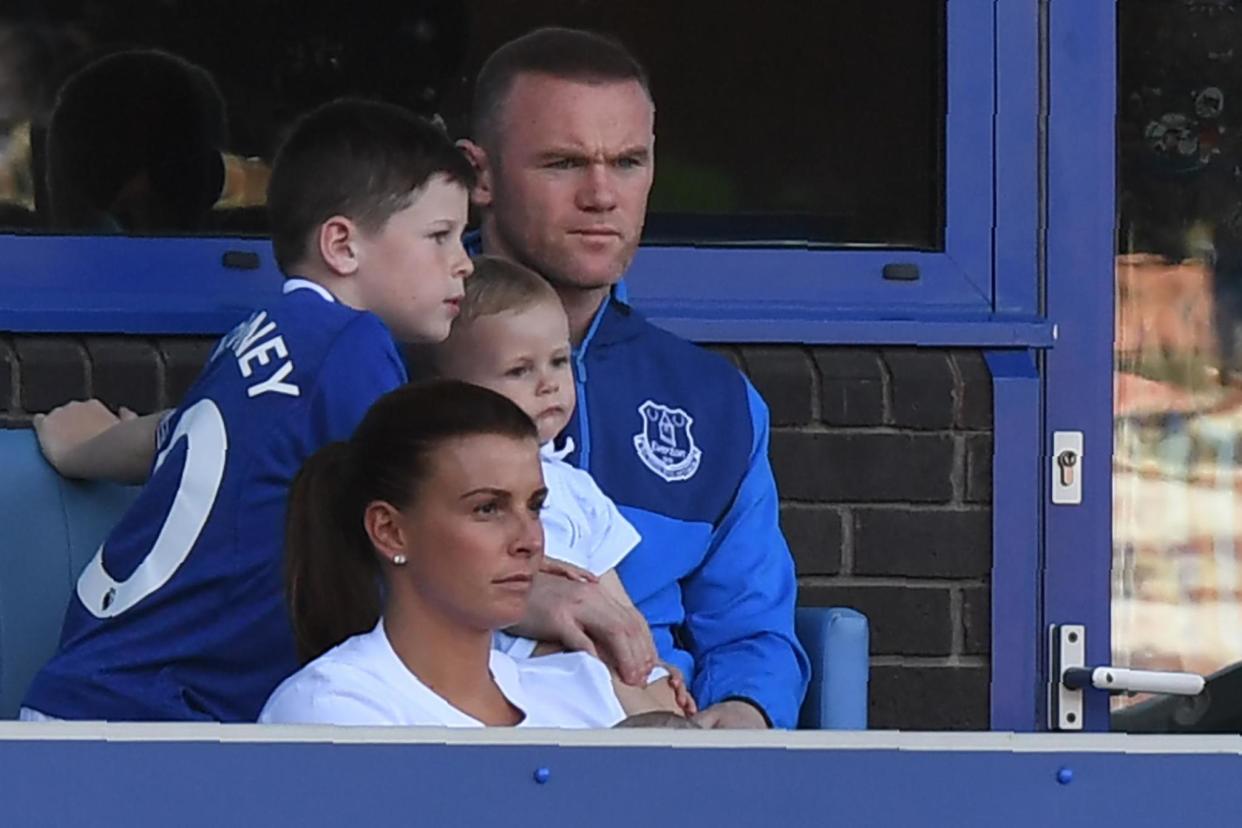 Wayne Rooney watches from the stands with wife Colleen and children during an Everton v Southampton game at Goodison park in May this year before he moved to DC United: AFP/Getty Images