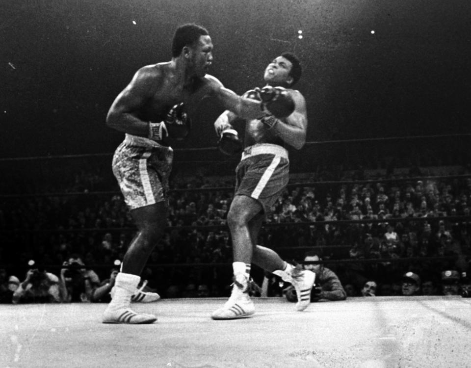 <p>Joe Frazier hits Muhammad Ali with a left during the 15th round of their heavyweight title fight at New York’s Madison Square garden in this March 8, 1971 photo. (AP Photo)</p> 