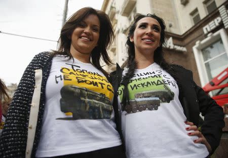 Women demonstrate T-shirts as they take part in a campaign organized by activists of pro-Kremlin patriotic movements in central Moscow, September 23, 2014. REUTERS/Maxim Zmeyev