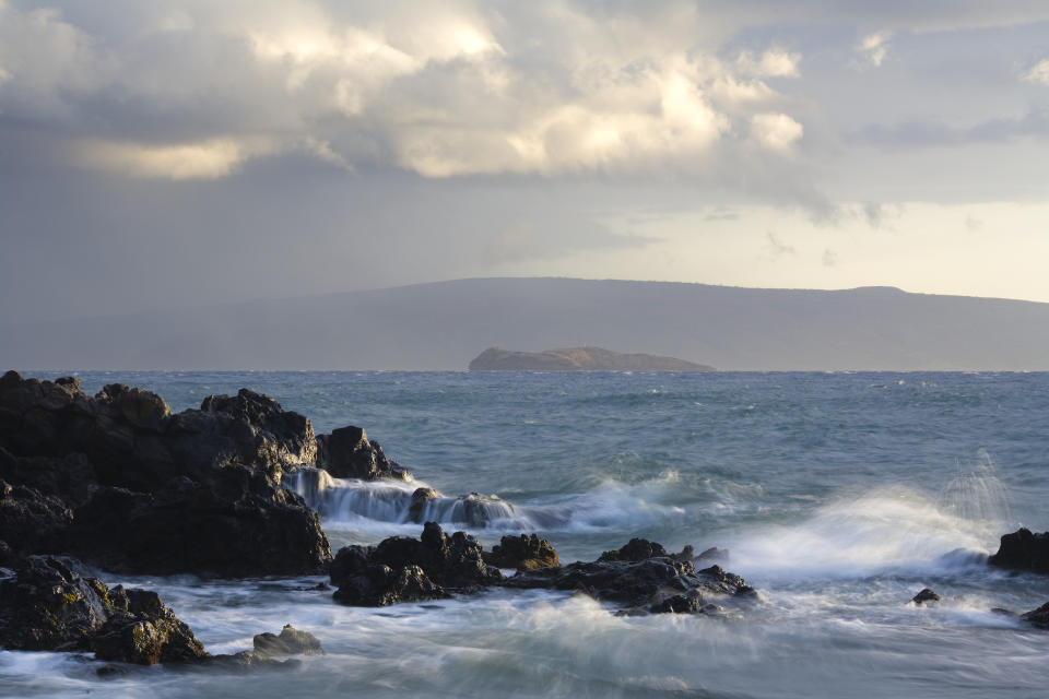 The Molokini Crater with the island of Kaho'olawe in the background.