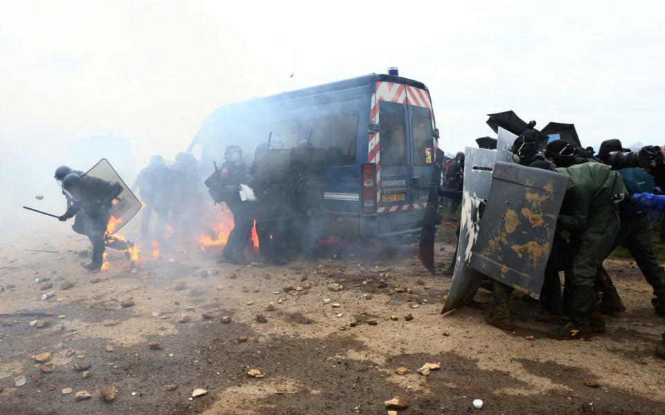 Protesters clash with the gendarmerie during a demonstration called by the collective "Bassines Non Merci" in Sainte-Soline - AFP