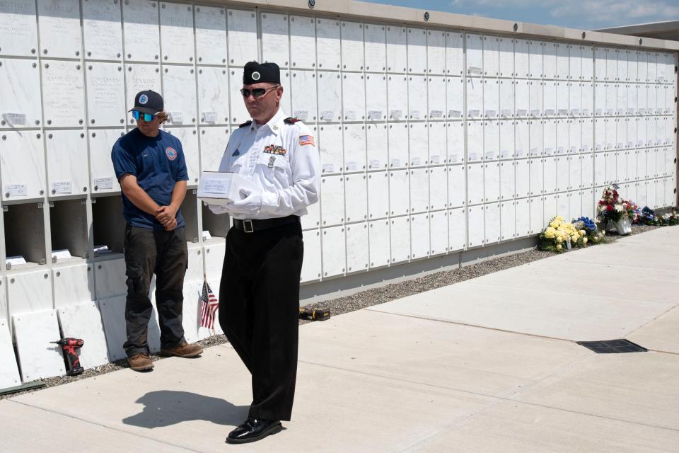 Veterans carry the unclaimed veterans' ashes into the columbarium at Washington Crossing National Cemetery in Upper Makefield on Thursday, June 30, 2022. Bucks County Coroner's Office and Montgomery County Coroner's Office honored their unclaimed veterans at a combined service with the attendance of community members and veterans.