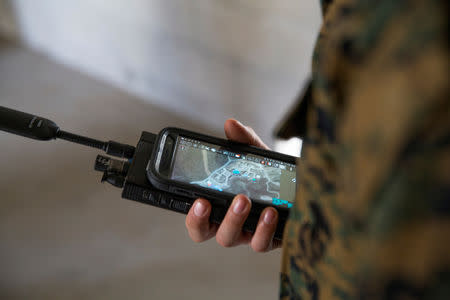 FILE PHOTO: A U.S. Marine is assessed utilizing a communications radio with real time on screen GPS location during Urban Advanced Naval Technology Exercises 2018 (ANTX18) at Camp Pendleton, California, U.S. March 20, 2018. Picture taken March 20, 2018. U.S. Marine Corps/Lance Cpl. Cutler Brice/Handout via REUTERS./File Photo