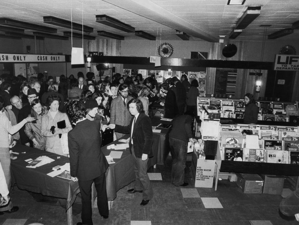 Customers and staff at the HMV shop in Oxford Street, London, during a power-cut, 19th December 1973. Power cuts, intended to conserve fuel during the miners strike, are a regular occurrence. (Photo by Angela Deane-Drummond/Evening Standard/Hulton Archive/Getty Images)