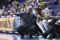 Texas Southern head coach Johnny Jones, left, talks with forward Joirdon Karl Nicholas during the second half of an NCAA college basketball game against Florida, Monday, Dec. 6, 2021, in Gainesville, Fla. (AP Photo/Matt Stamey)