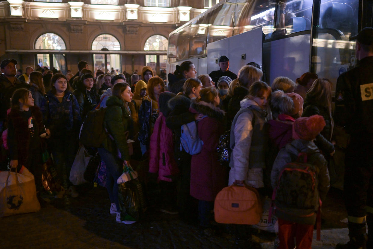 PREZEMYSL, POLAND - MARCH 23: People, mainly women and children, board coaches at Przemysl station as they continue their onward journey from war-torn Ukraine on March 23, 2022 in Przemysl, Poland. Nearly two-thirds of the more than 3 million people to have fled Ukraine since Russia's invasion last month have come to Poland, which shares a 310-mile border with its eastern neighbor. (Photo by Jeff J Mitchell/Getty Images)