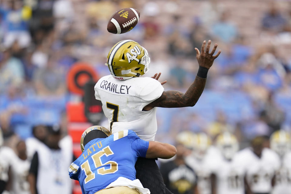 FILE - Alabama State quarterback Myles Crawley (7) loses possession of the ball as he is tackled by UCLA linebacker Laiatu Latu (15) during the first half of an NCAA college football game in Pasadena, Calif., Saturday, Sept. 10, 2022. UCLA opens their season at home against Coastal Carolina on Sept. 2. (AP Photo/Ashley Landis, File)