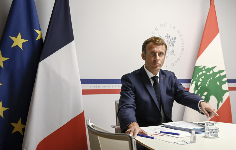 France's President Emmanuel Macron attends an international video conference at the Fort de Bregancon, in Bormes-Les-Mimosas, southern France, Wednesday, Aug. 4, 2021. The virtual event, co-hosted by France and the United Nations, is meant to show support towards Lebanese people, French President Emmanuel Macron said. France will provide 100 millions euros ($118.6 million) in the coming months, Macron said in his opening remarks. (Christophe Simon/Pool Photo via AP)