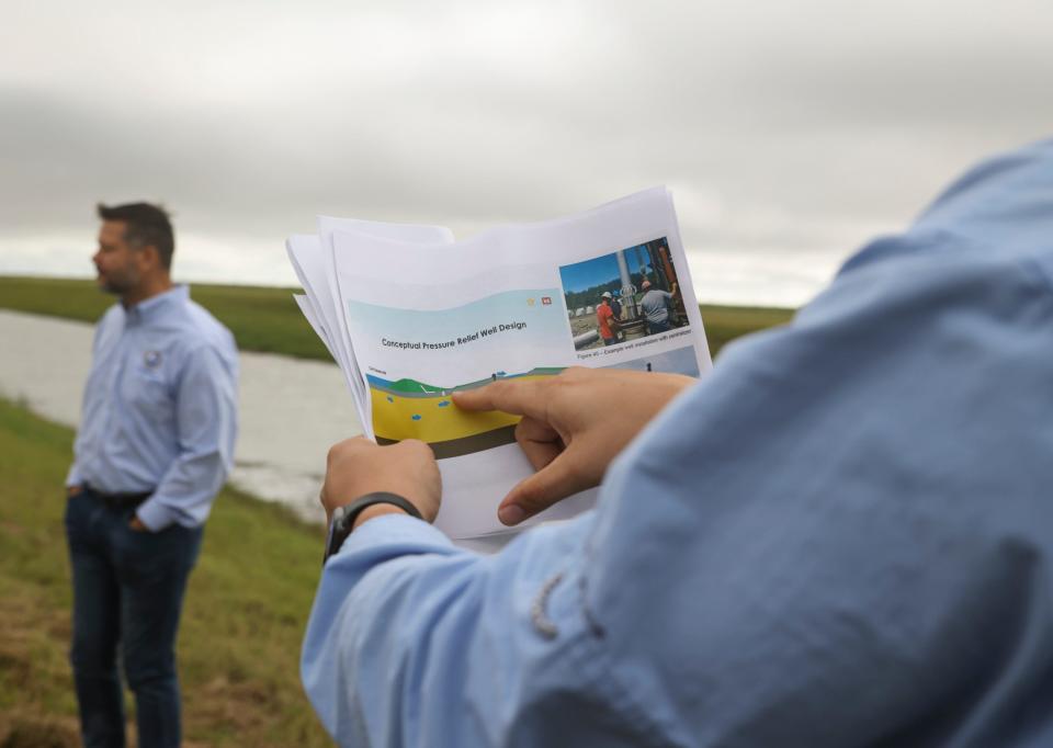 Matt Taylor, Army Corps of Engineers safety program manager, discusses the conceptual pressure relief well design that could possibly fix the two areas where water from the C-44 Reservoir is leaking and emerging through the perimeter canal bank, Friday, Nov. 17, 2023, in western Martin County. The C-44 Reservoir and Stormwater Treatment Area includes a 34-acre reservoir that captures, stores and cleans polluted stormwater that drains into the C-44 Canal, mostly from western area farms and keep some of the runoff out of the St. Lucie River.