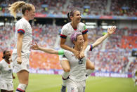 United States' Megan Rapinoe, right, celebrates after scoring the opening goal from the penalty spot during the Women's World Cup final soccer match between US and The Netherlands at the Stade de Lyon in Decines, outside Lyon, France, Sunday, July 7, 2019. (AP Photo/Francisco Seco)